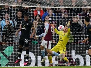 Aston Villa's Emiliano Buendia scores their side's third goal 