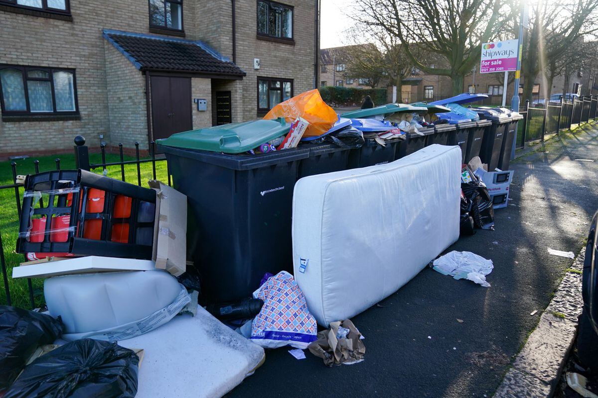 Overflowing rubbish bins on Park Road North in Aston, Birmingham