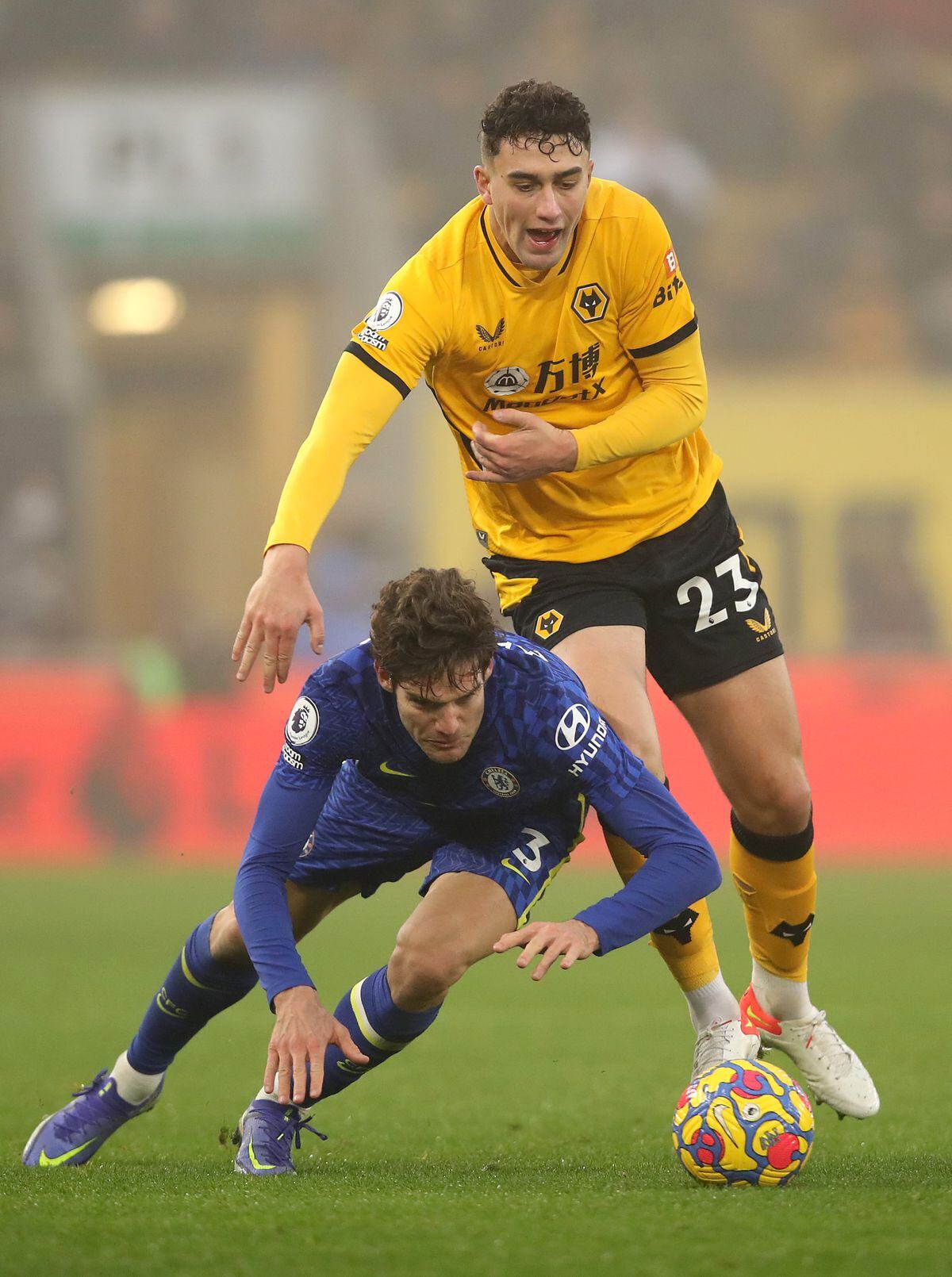 Marcos Alonso of Chelsea is challenged by Max Kilman of Wolverhampton Wanderers (Photo by Jack Thomas - WWFC/Wolves via Getty Images).