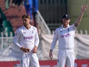 England's skipper Ben Stokes adjusts fielding as Will Jacks watches during the third day of the first test cricket match between Pakistan and England, in Rawalpindi, Pakistan, Saturday, Dec. 3, 2022. (AP Photo/Anjum Naveed).