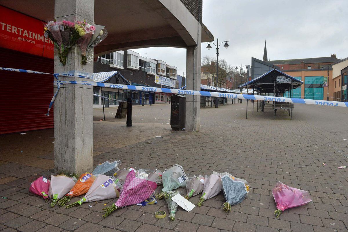 Floral tributes were left at the police cordon 