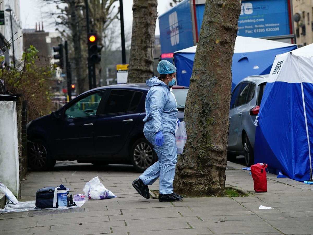 Police working at the scene of the deaths in Maida Vale, west London on Monday