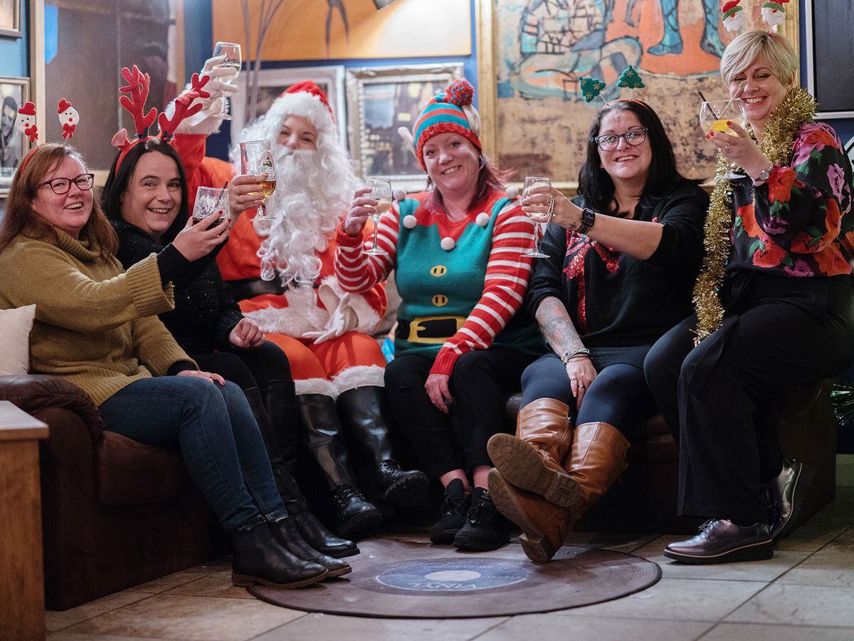 Getting ready for the Christmas Extravaganza are Sarah Glynn (Petals by Sarah Louise), Stephanie French (Albrighton Parish Council and the Old Bush), Vicky Shepherd (as Santa), Sally Hall (Next Door Bar), Michelle Smith (Next Door Bar) and Amanda Potter (Number 7) 