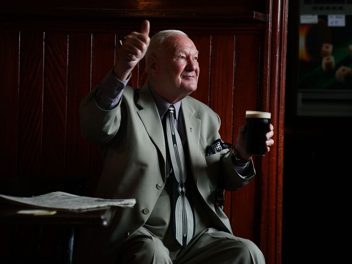 Peter Roche, a regular for 55 years at Mulligans pub in Dublin’s city centre, in conversation while having a pint