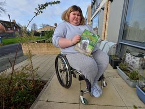 Picture of Katie Stone who buys an annual pass to West Midlands Safari Park, but due to changes to admission prices her carer will now have to pay £50 for an annual pass. 