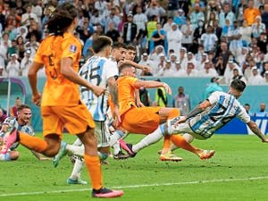 Netherlands’ Wout Weghorst scores hisside’s second goal to level their WorldCup quarter-final match against Argentina
