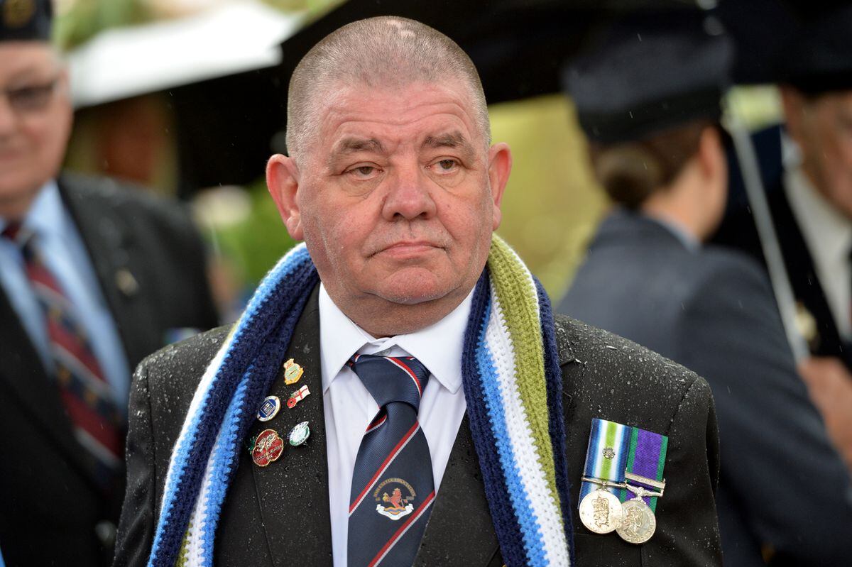 A veteran wears the Falklands scarf. 