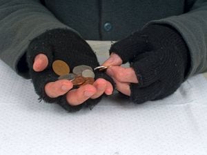 Poverty UK with coins
