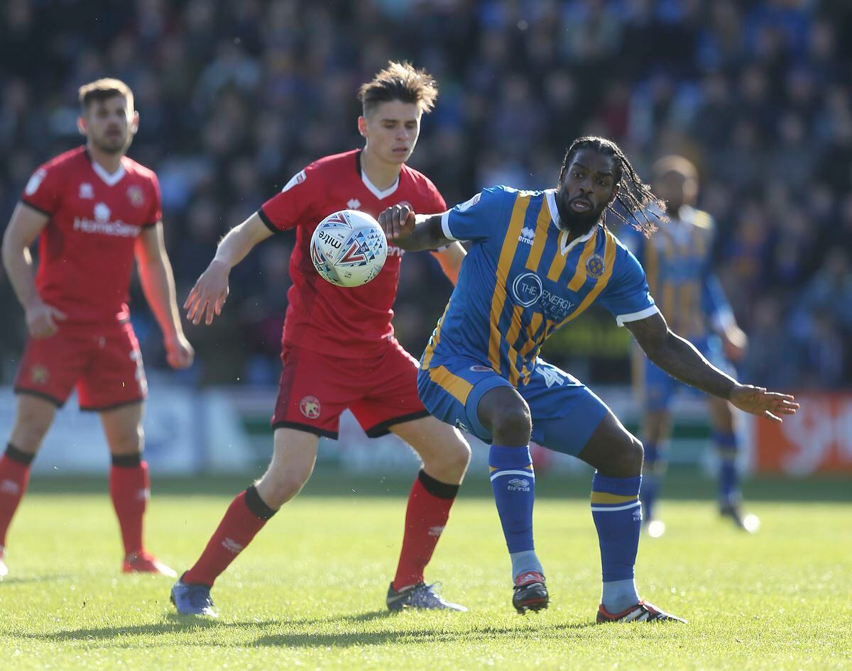 George Dobson of Walsall and Anthony Grant of Shrewsbury Town. (AMA)