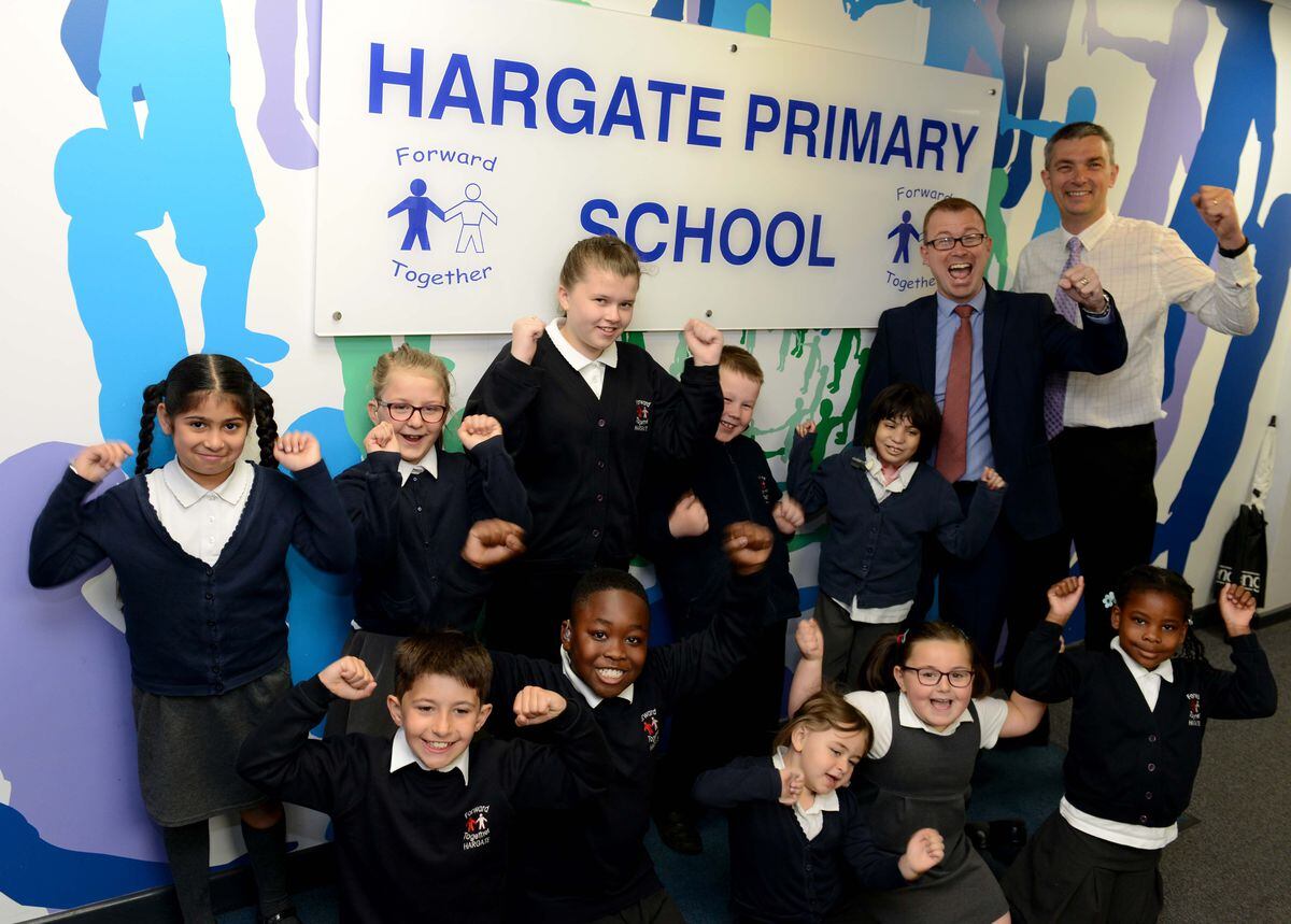 Hargate Primary School headteacher Andrew Orgill and deputy head Richard Hipkiss celebrate with pupils