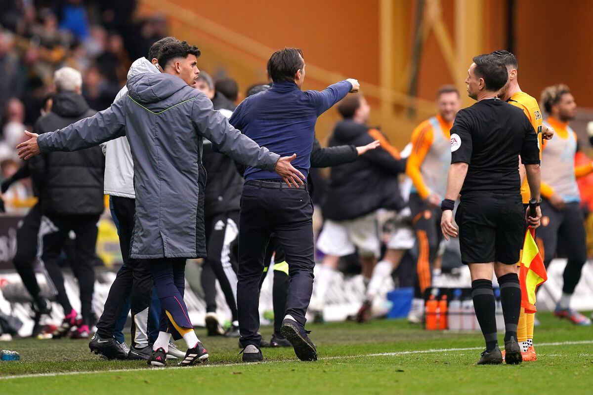               Wolverhampton Wanderers substitute Matheus Nunes (left) reacts to assistant referee Gary Beswick before being shown a red card