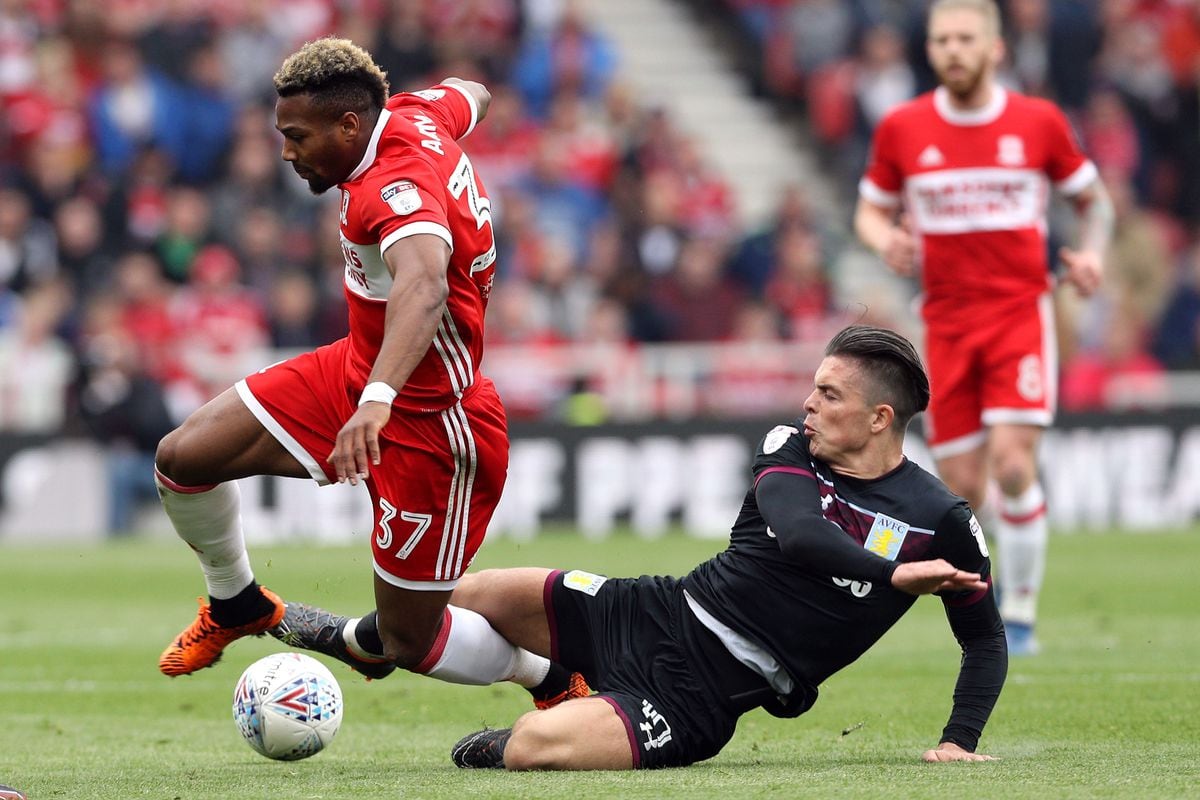 Middlesbrough's Adama Traore (left) and Aston Villa's Jack Grealish battle for the ball