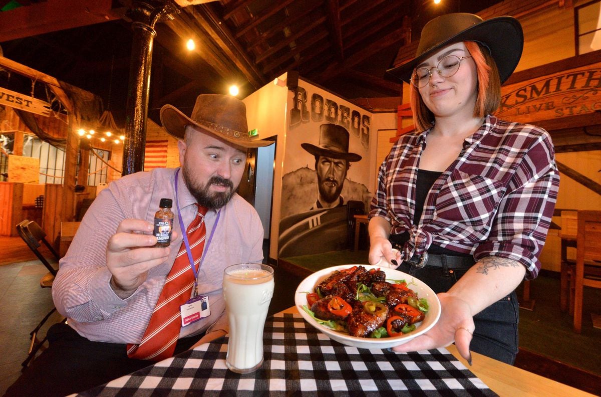 Amy Britton serves up the Seven Deadly Wings to Express and Star reporter James Vukmirovic