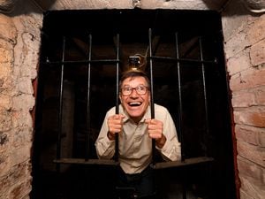 Visitor Paul Davies taking a peek inside the 17th century cellar