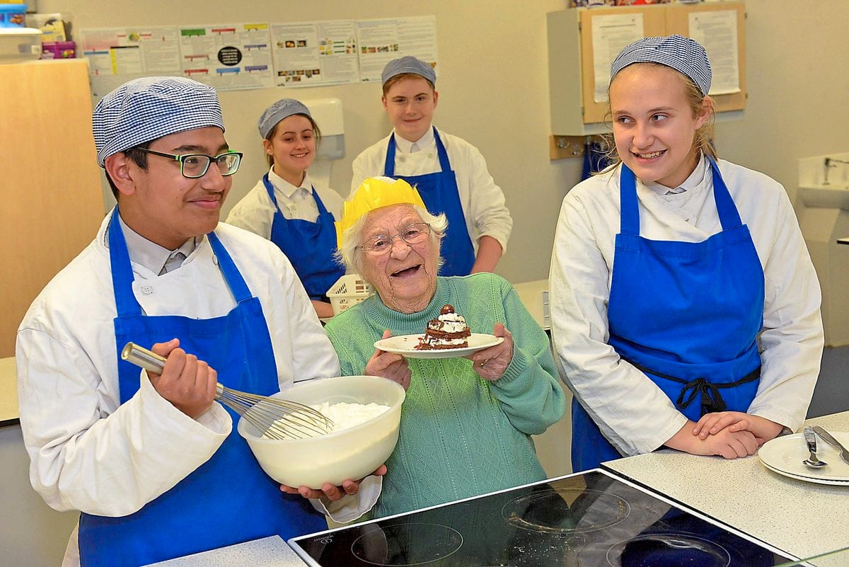 Resident Betty Riley, aged 89, spoilt by pupils at Wodensborough Ormiston Academy Ruben Gahir 14, Donna Cooper 15, Lewis Gould and Alice Green, both 14