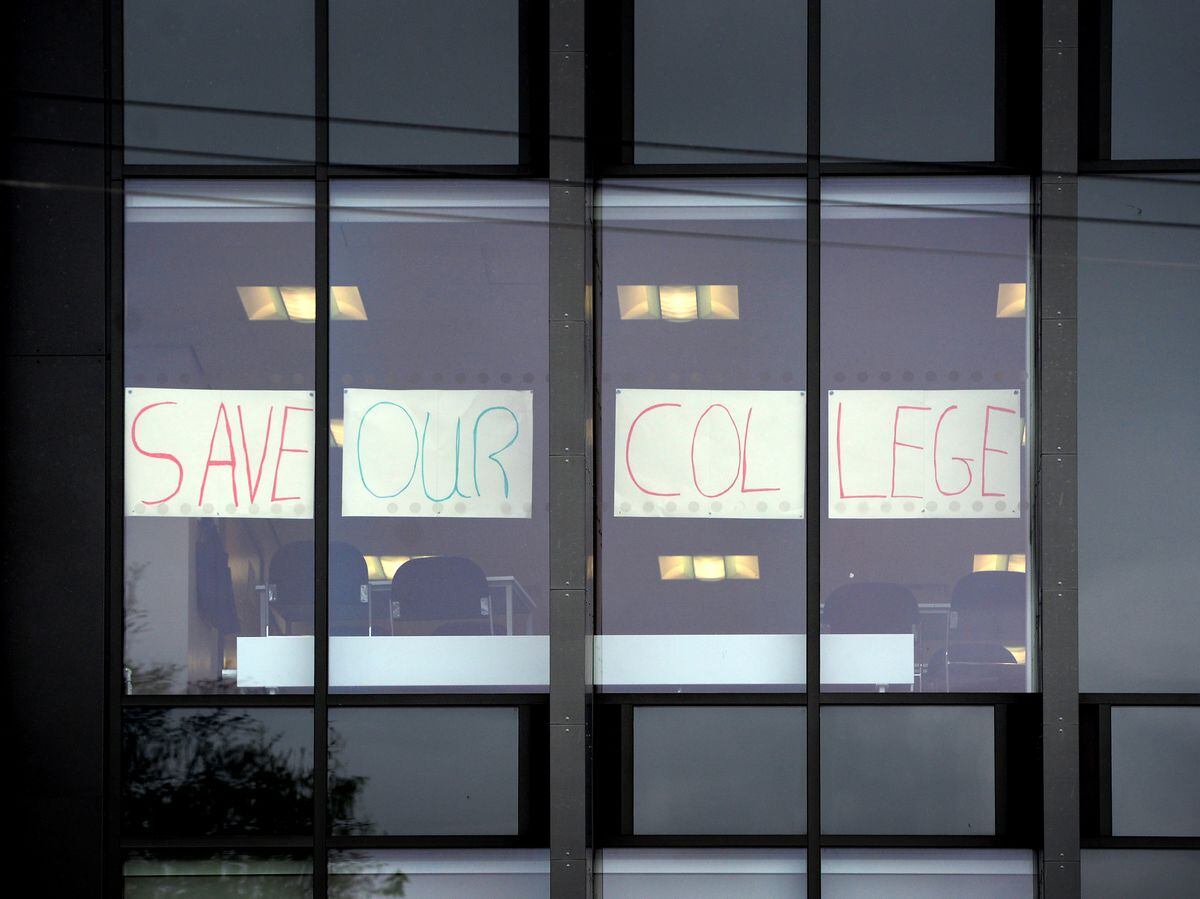 A Save our College sign has been placed in the window at the entrance to the Hagley Road campus 