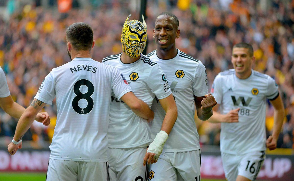Raul Jimenez donning the Sin Cara mask following his goal against Watford