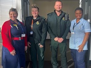 Michelle Redding, Teresa Bednallangell and Derek Varden with Faith Ike at the Ambulance Receiving Centre 