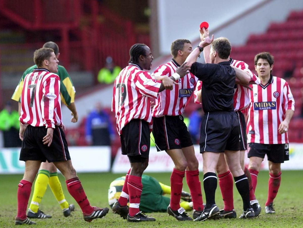 Sheffield United's George Santos gets the red card with Albion's Andy Johnson lies injured on the pitch during their games at Bramall Lane.
