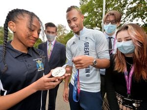 Boxer Ben Whittaker shows Wednesfield High Academy pupils Tiarna Grizzle 14, Luke Mills 18, Archie Price 17 and Sadie Knight 17, his medal