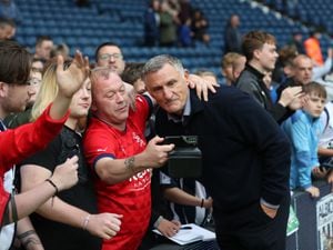 Tony Mowbray poses for selfies and signs autographs for fans after the match at The Hawthorns on September 24, 2022 in West Bromwich, England. (Photo by Adam Fradgley/West Bromwich Albion FC via Getty Images).