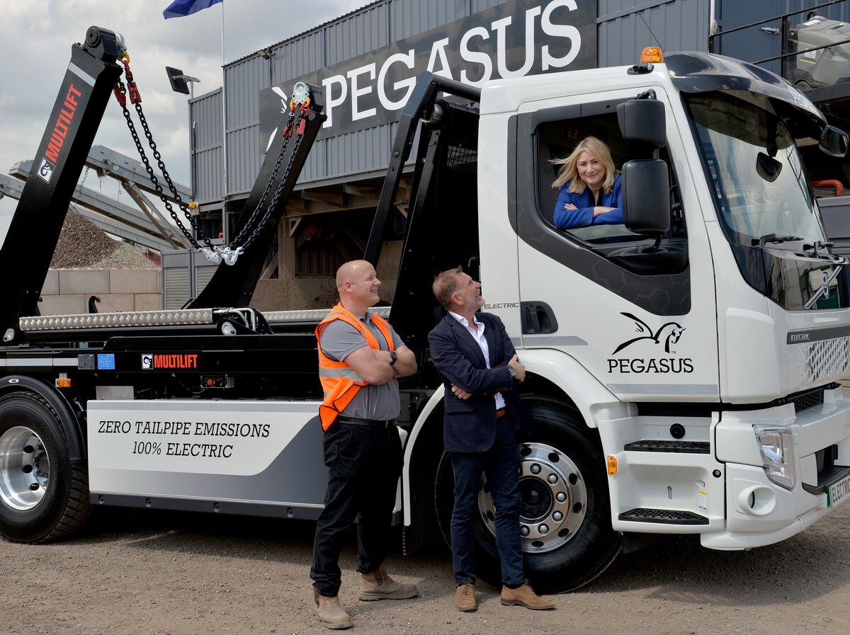 Tony Hall, Martin Cronin and Suzanne Webb MP with the new Volvo FE Electric at the Pegasus depot