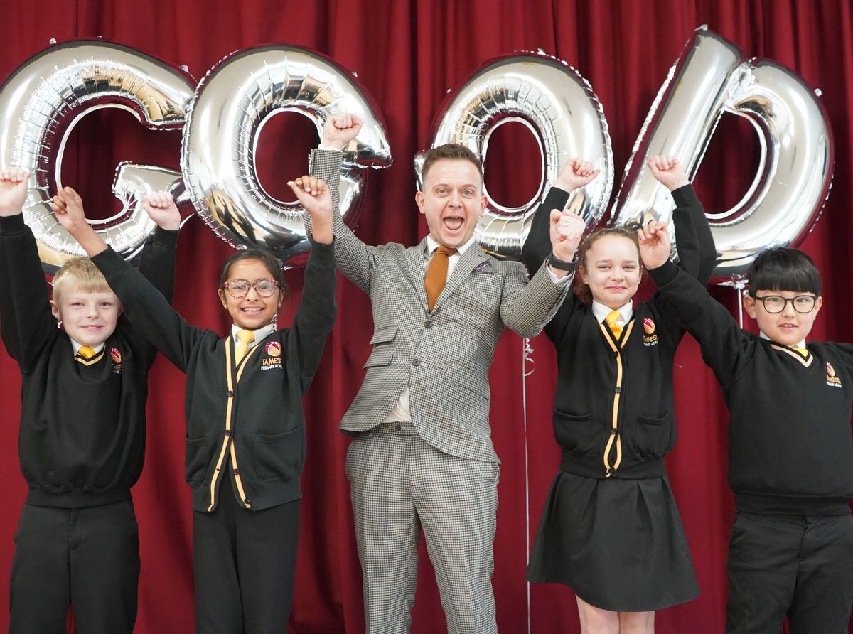 Principal Mitchell Hill and pupils at Tameside celebrate a good Ofsted report.