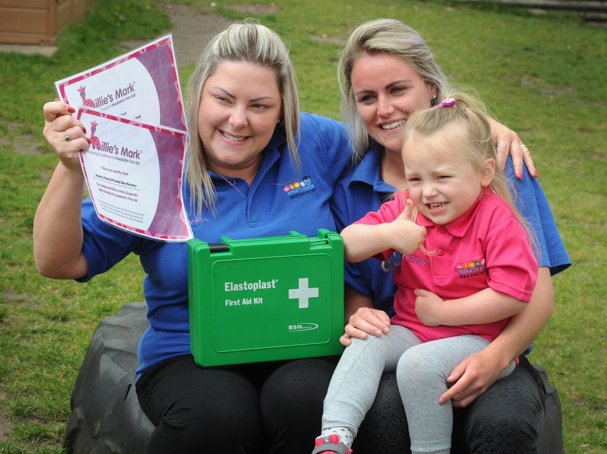 Happy to be awarded Milllie's Mark, (left-right) owner Lydia Browning, of Sedgley, room leader Chelsea Davies, of Dudley, with Macey-Drew Smith, aged 3, of West Bromwich, at Smarty Pants Day Nursery, Tipton