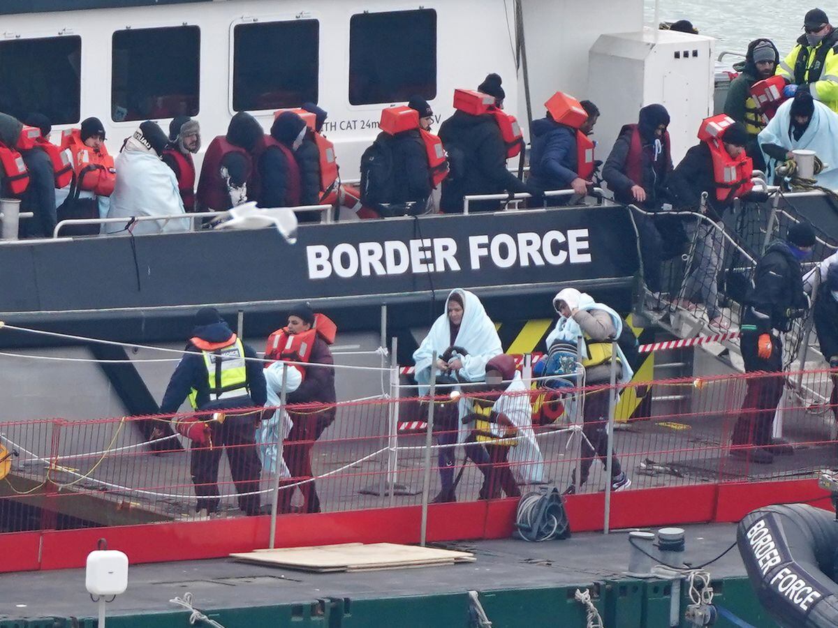 A group of migrants are brought in to Dover, Kent, following a small boat incident in the Channel on March 6 [Gareth Fuller/PA Wire]