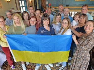 Sian Siddall (far right) welcomes the Ukrainian families and their hosts to the Plaza