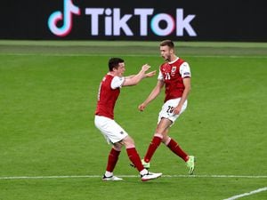 Austria's Sasa Kalajdzic (right) celebrates scoring their side's first goal of the game during the UEFA Euro 2020 round of 16 match held at Wembley Stadium, London. Picture date: Saturday June 26, 2021..
