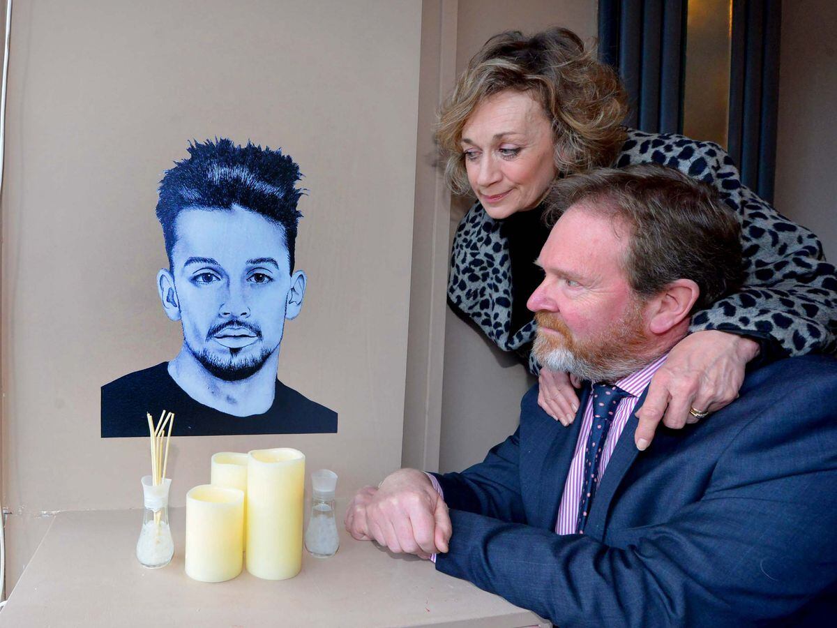 Beverley and Mark Brindley with the portrait of their son James near where he was murdered