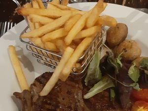 Rump steak with fries and cherry tomatoes