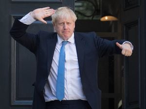 Thumbs up! Boris Johnson was today being confirmed as Prime Minister