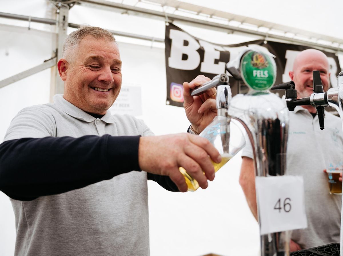 Neil Parks serves one of the lagers to a customer