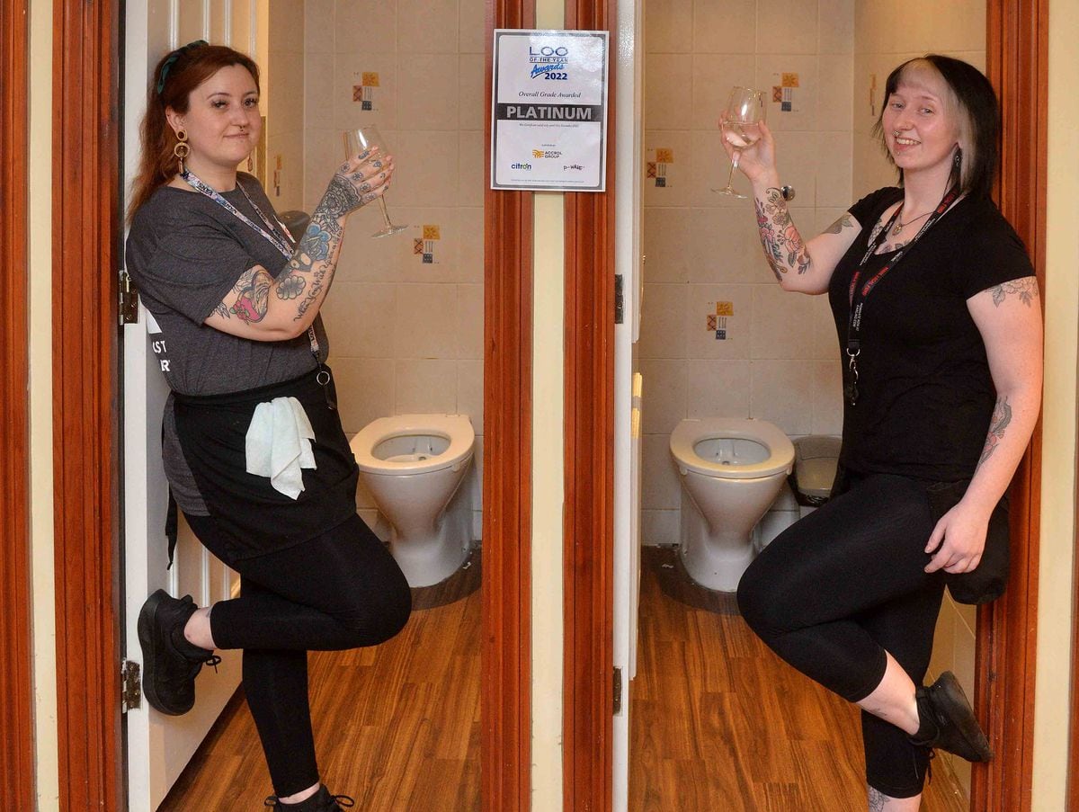 Staff members Katie Totney and Kirstie Fereday are pictured with a toast in the toilet