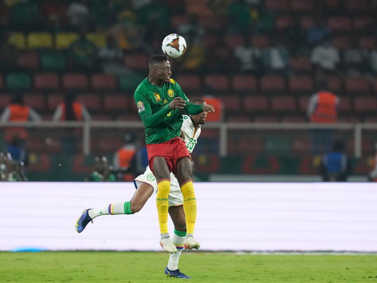Cameroon’s Martin Hongla, foreground, heads the ball (Themba Hadebe/AP)