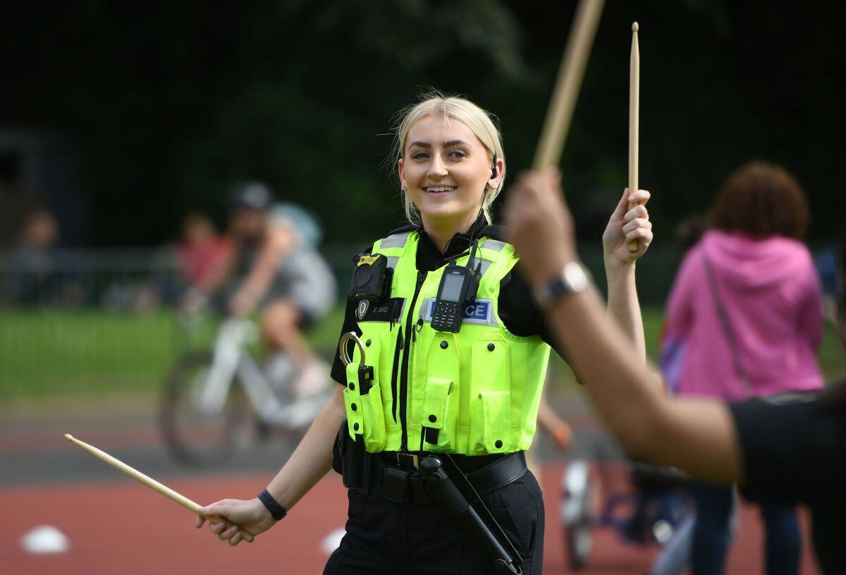 A police officer joins in the fun. Picture: Richard Harris  