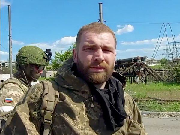 In this photo taken from video released by the Russian defence ministry on Saturday May 21 2022, Serhiy Volynskyy, nicknamed Volyna, commander of Ukraine’s 36th Special Marine Brigade of Ukraine’s Naval Forces lines up to be checked as he leaves the besieged Azovstal steel plant in Mariupol, in territory under the government of the Donetsk People’s Republic, eastern Ukraine