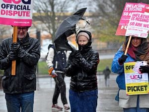Wolverhampton University staff battle the horrendous weather as they take strike action