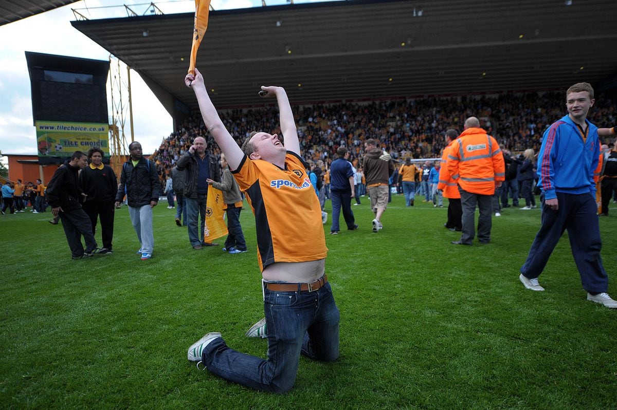 Wolves fans celebrate their Premiership survival.