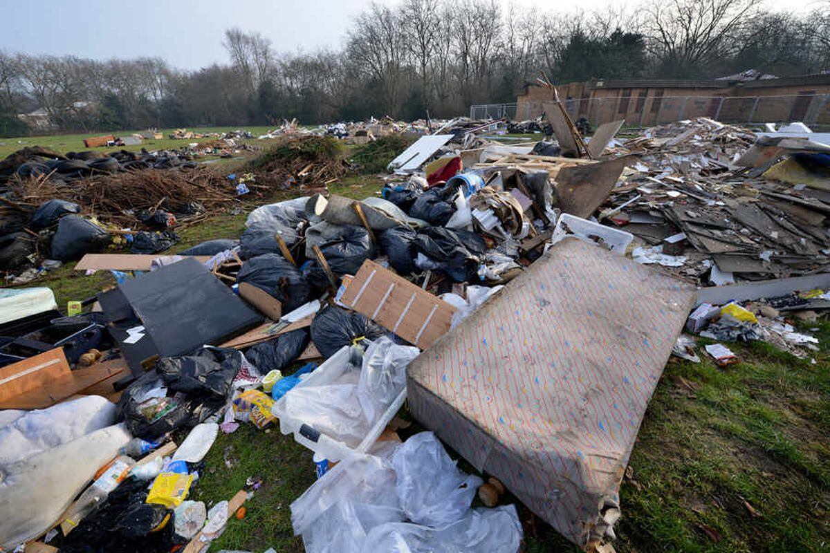 Huge rubbish pile left after travellers' camp moved off Smethwick park - WATCH