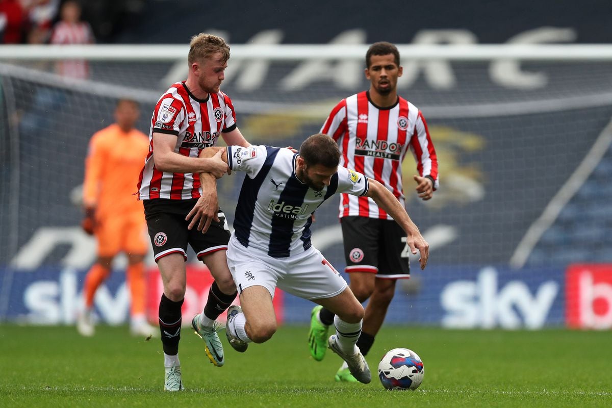 Tommy Doyle of Sheffield United fouls Erik Pieters of West Bromwich Albion  during the Sky Bet Championship between West Bromwich Albion and Sheffield United at The Hawthorns on October 29, 2022 in West Bromwich, United Kingdom. (Photo by Adam Fradgley/West Bromwich Albion FC via Getty Images).