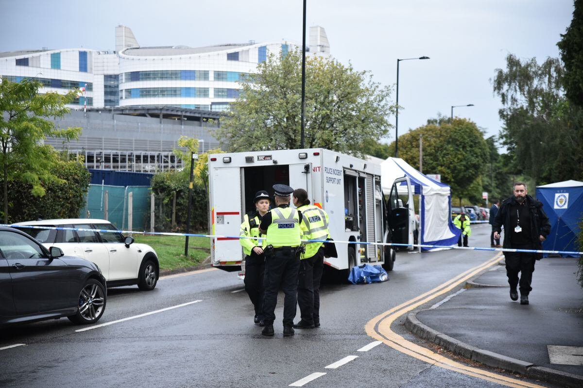 Murder investigation as man found stabbed to death in crashed car near QE hospital