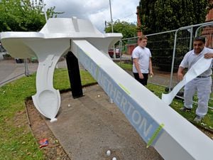 Fencing has gone up around the Titanic Replica Anchor on Northfield Road in Netherton while it is restored. Pictured from Bell group, Josh Mandley and Andy Hohn