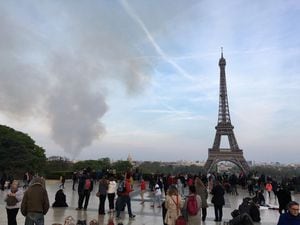 Smoke billows above the Paris sky