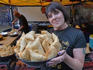 Tracie Thaff from Spice Fever with a bowl of samosas
