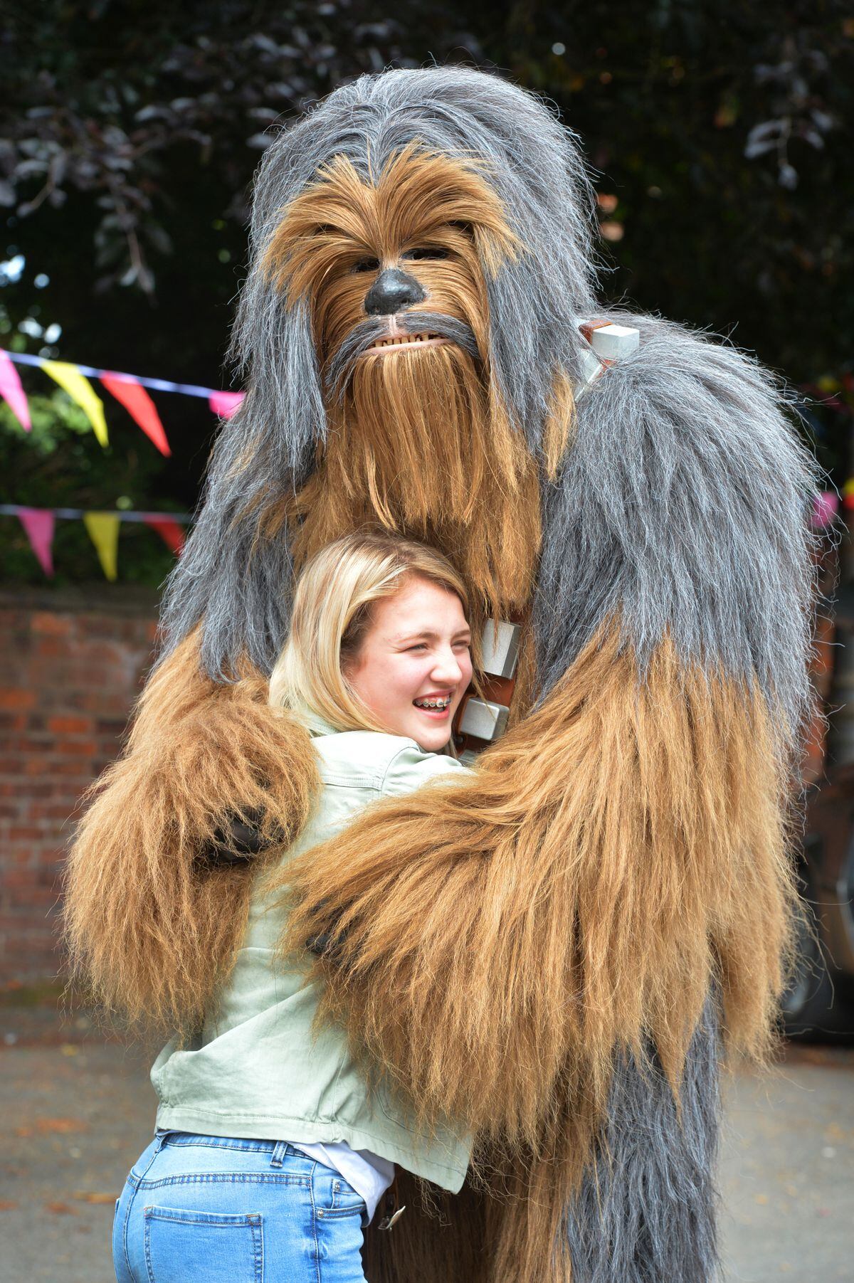 The 15-year-old has been able to get out and enjoy events as the guest of honour, as well as meeting stars such as Chewbacca