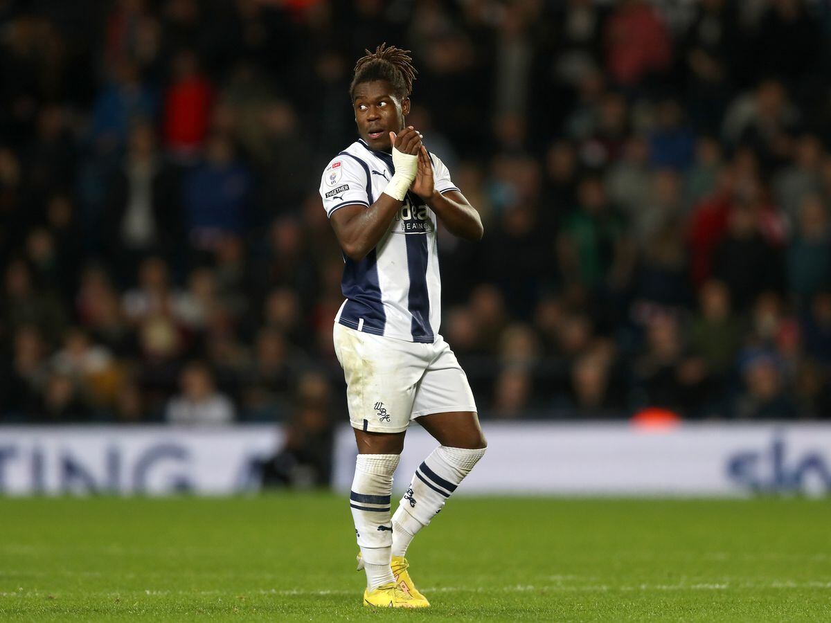 Brandon Thomas-Asante of West Bromwich Albion applauds the West Bromwich Albion Fans as he is substituted in the second half during the Sky Bet Championship between West Bromwich Albion and Stoke City at The Hawthorns on November 12, 2022 in West Bromwich, United Kingdom. (Photo by Adam Fradgley/West Bromwich Albion FC via Getty Images).