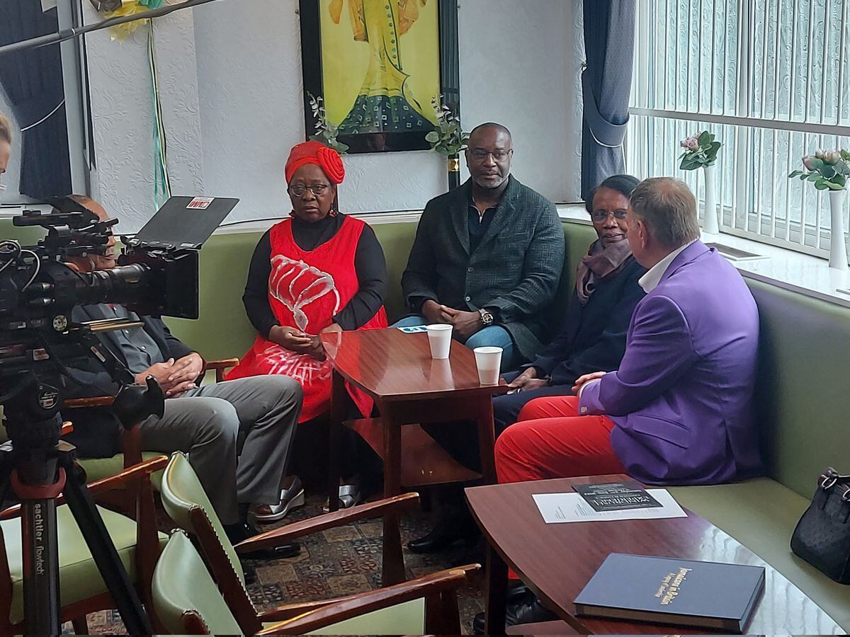 Michael Portillo sat with members of the Heritage Centre to learn about Windrush. Photo: @ppvernon